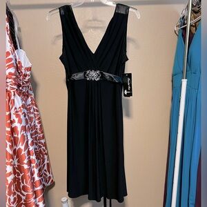 Black tie-back midi dress with jeweled silver-tone “buckle” affixed at waist